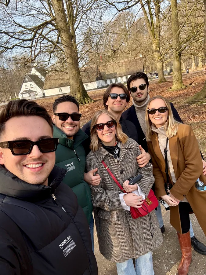 Klaudio, Derick, and friends together outdoors in winter
